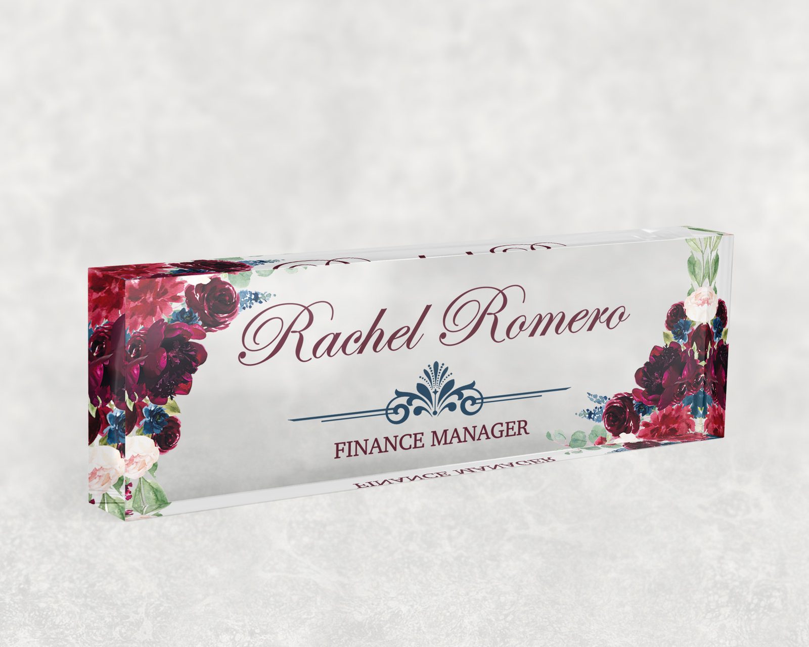 Burgundy rose desk name plate in clear acrylic, personalized with a name and job title
