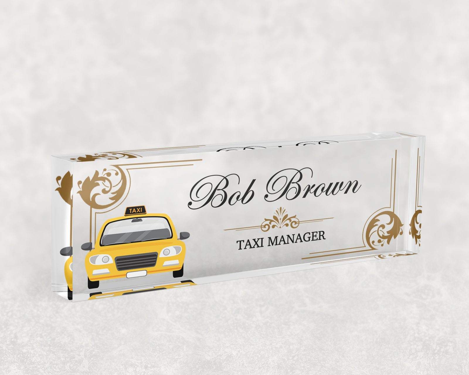 Yellow taxi desk name plate in clear acrylic, personalized with a name and job title