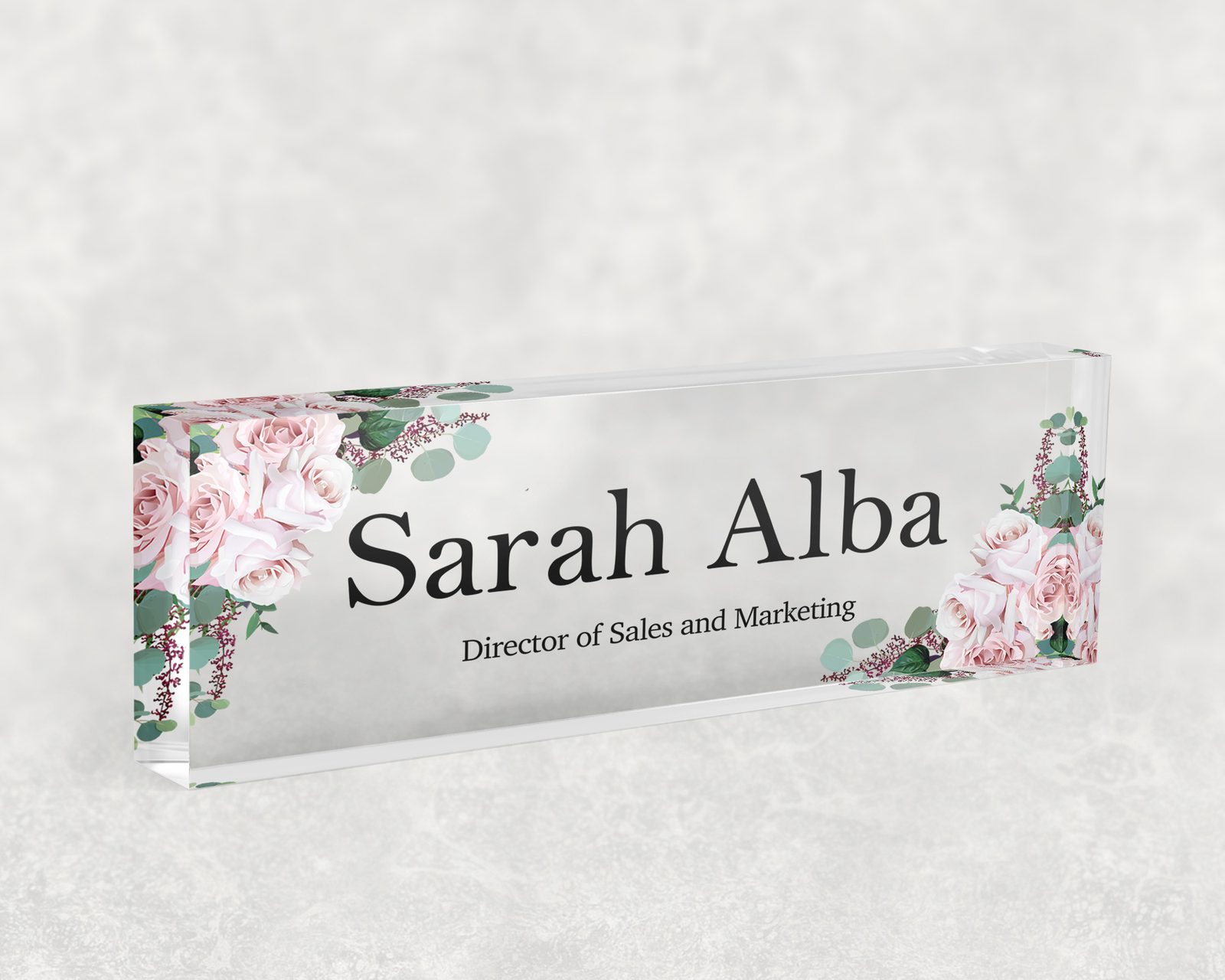 Blush rose and eucalyptus desk name plate in clear acrylic, personalized with a name and job title