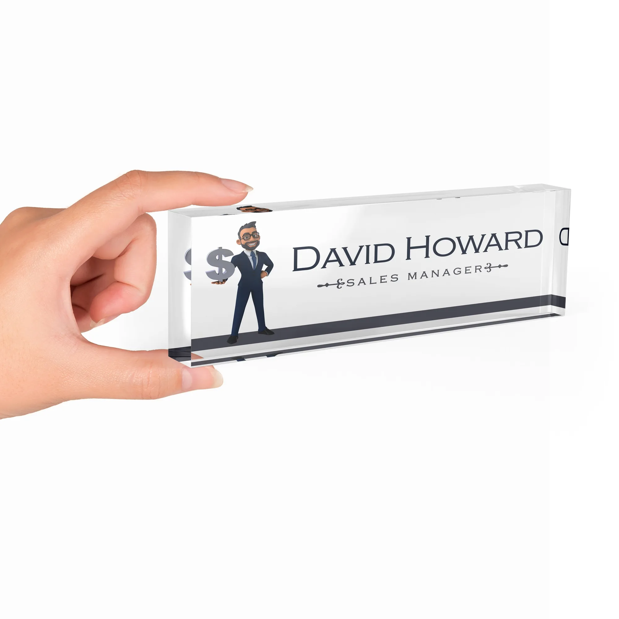 Hand holding a clear acrylic desk name plate with a cartoon sales manager design