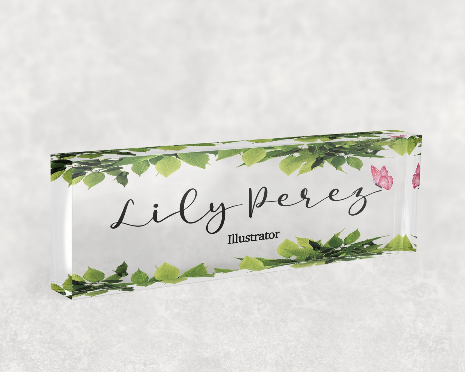 Trailing green ivy desk name plate in clear acrylic, personalized with a name and job title