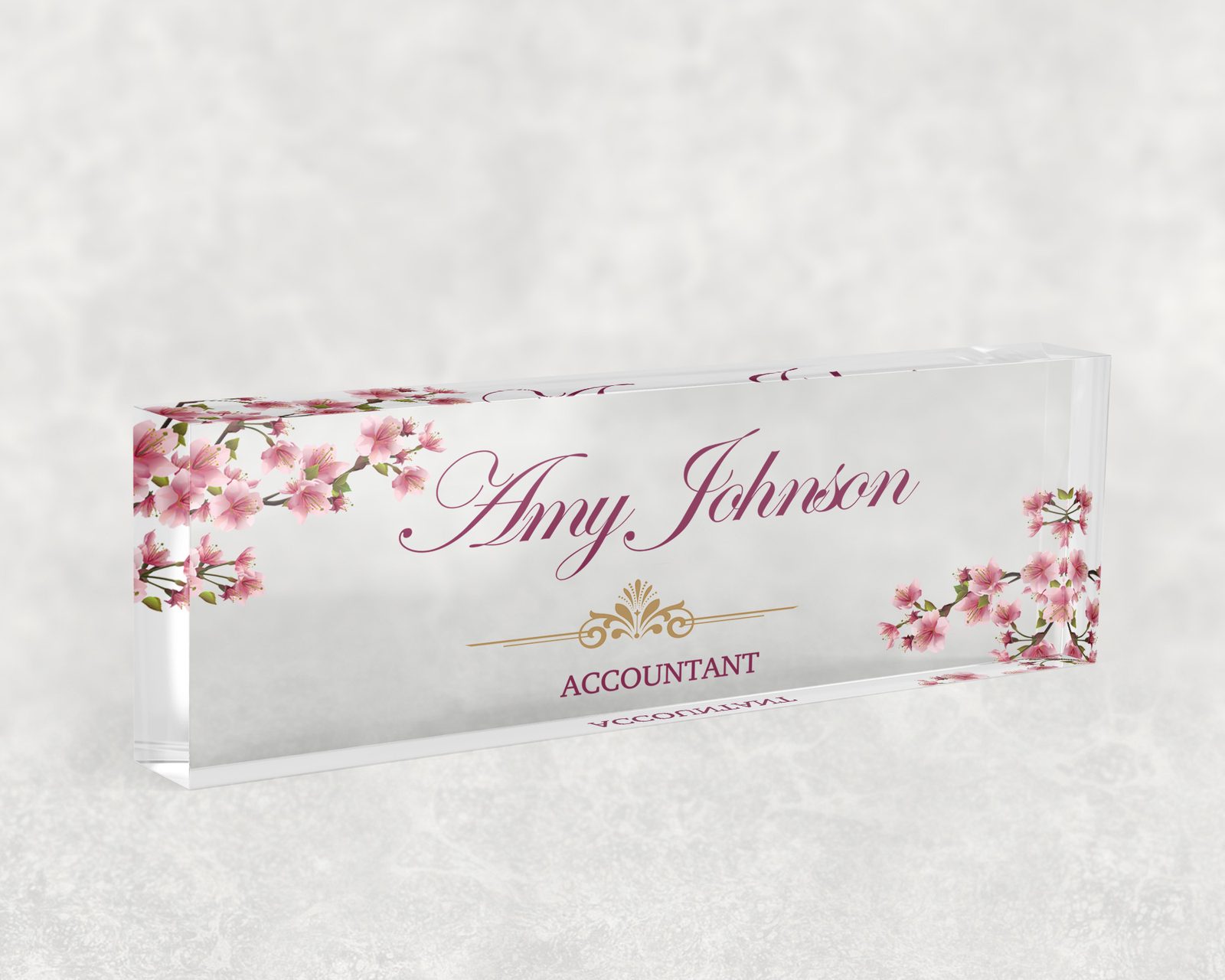 Pink cherry blossom desk name plate in clear acrylic, personalized with a name and job title