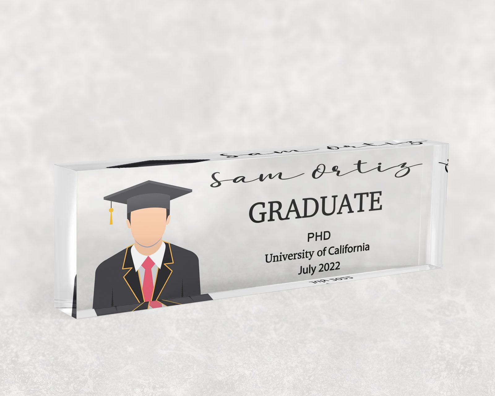 Cap and gown graduate desk name plate in clear acrylic, personalized with a name and job title