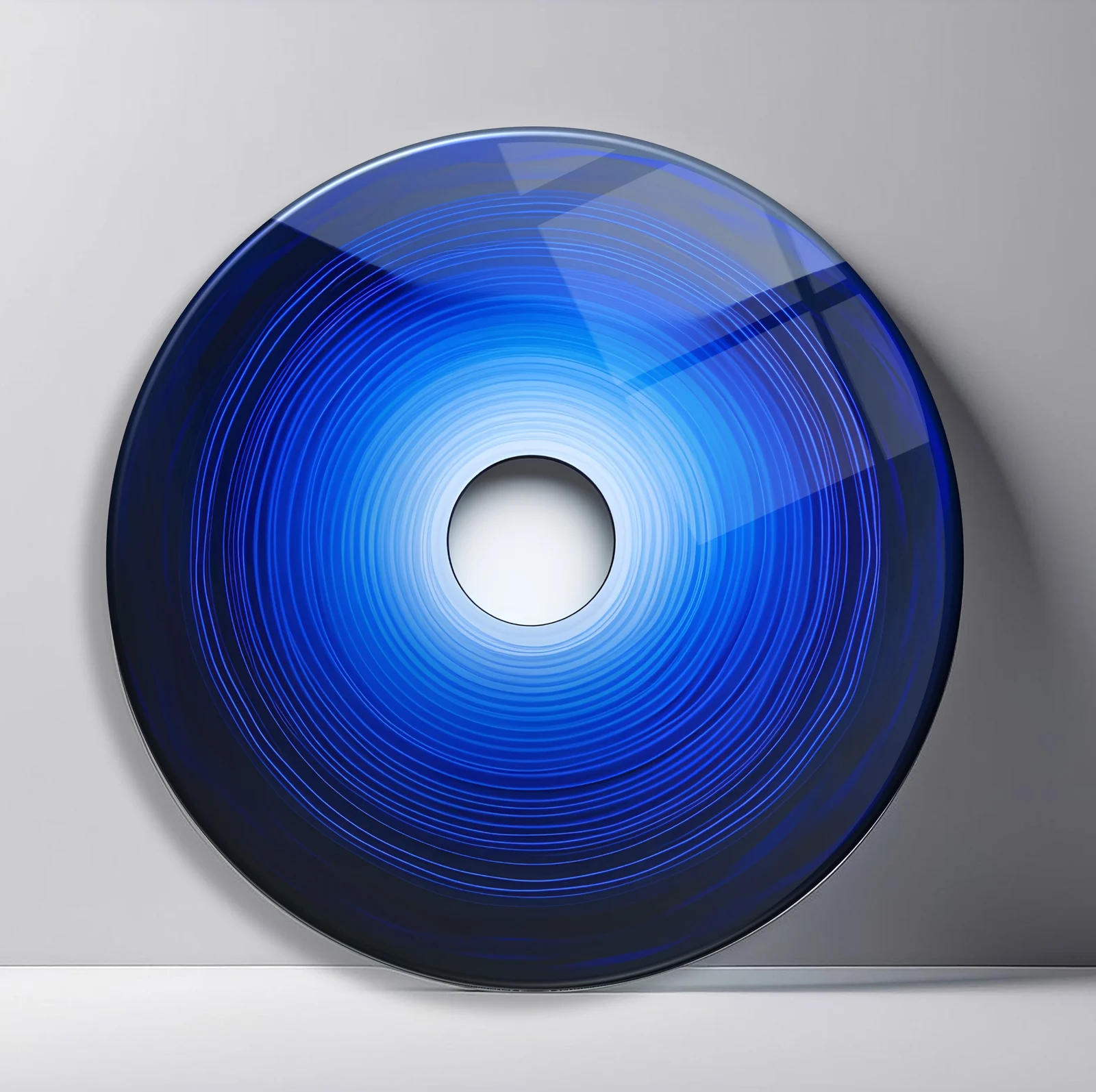 Cobalt Depth Rings Round Glass Wall Art featuring smooth blue gradient rings receding toward a bright white opening