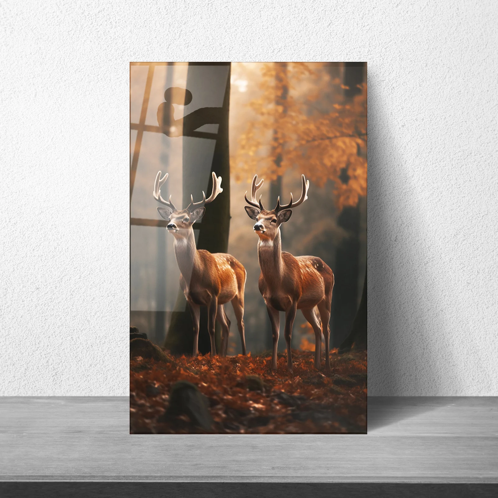 Two deer in autumn forest glass wall art displayed above a sofa
