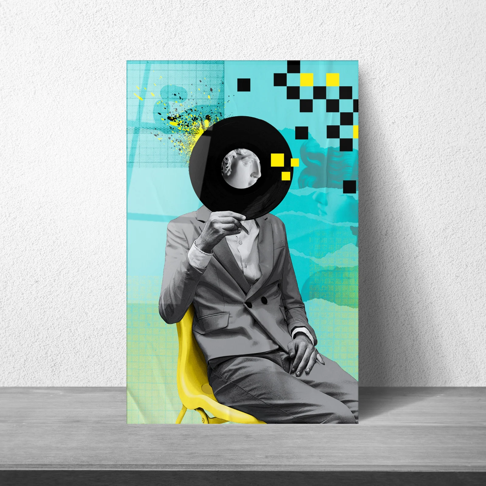 Vinyl-head music collage glass wall art displayed above a sofa