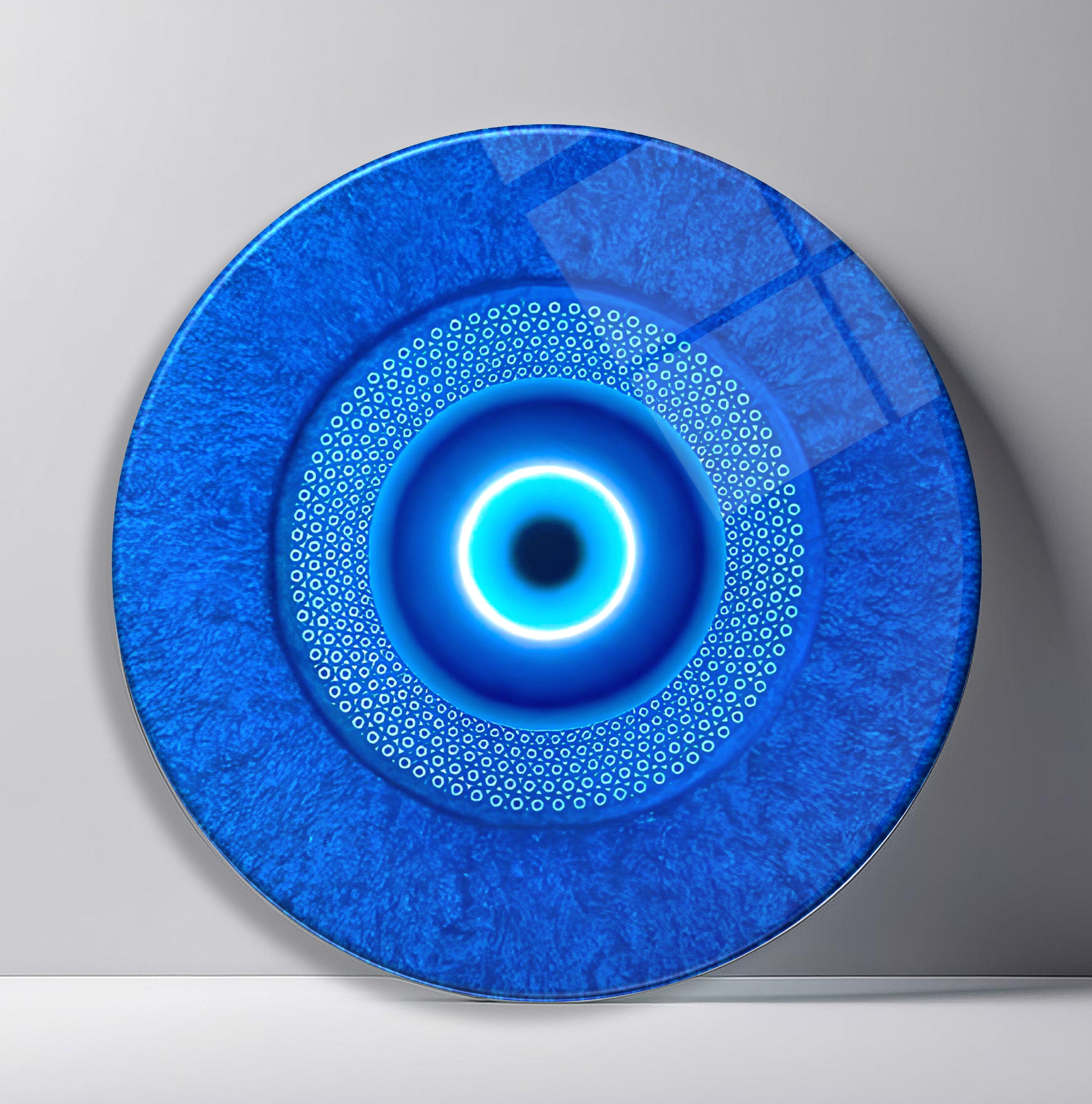 Electric Nazar Halo Round Glass Wall Art featuring glowing cyan protective eye centered on a textured royal blue field