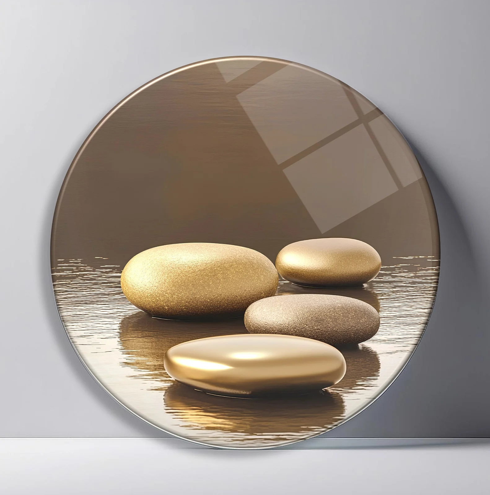 Golden Zen Stones Round Glass Wall Art featuring stacked smooth gold and taupe stones reflected on calm water