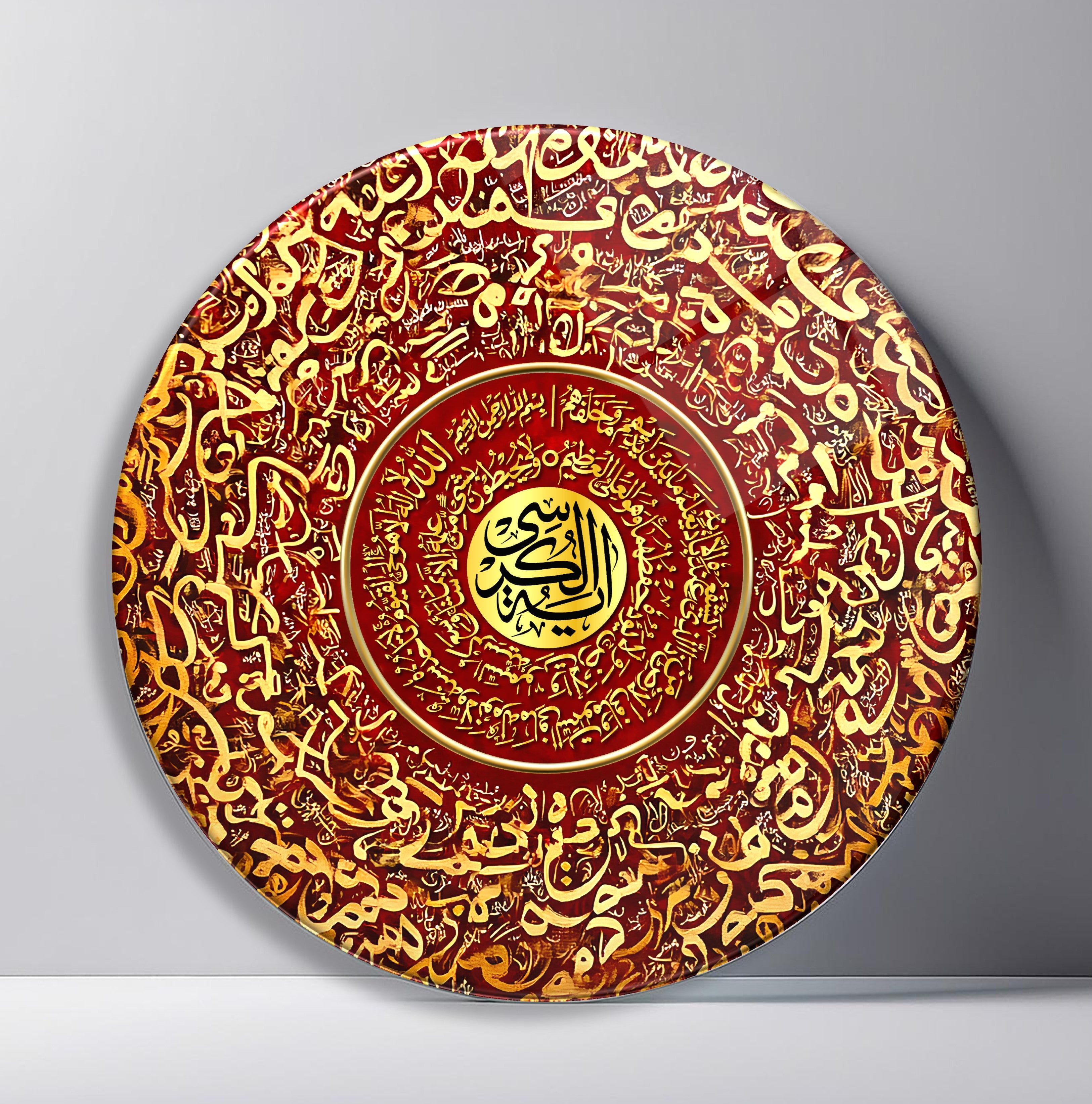 Crimson Gold Arabic Calligraphy Medallion Round Glass Wall Art front view, leaning against a neutral wall