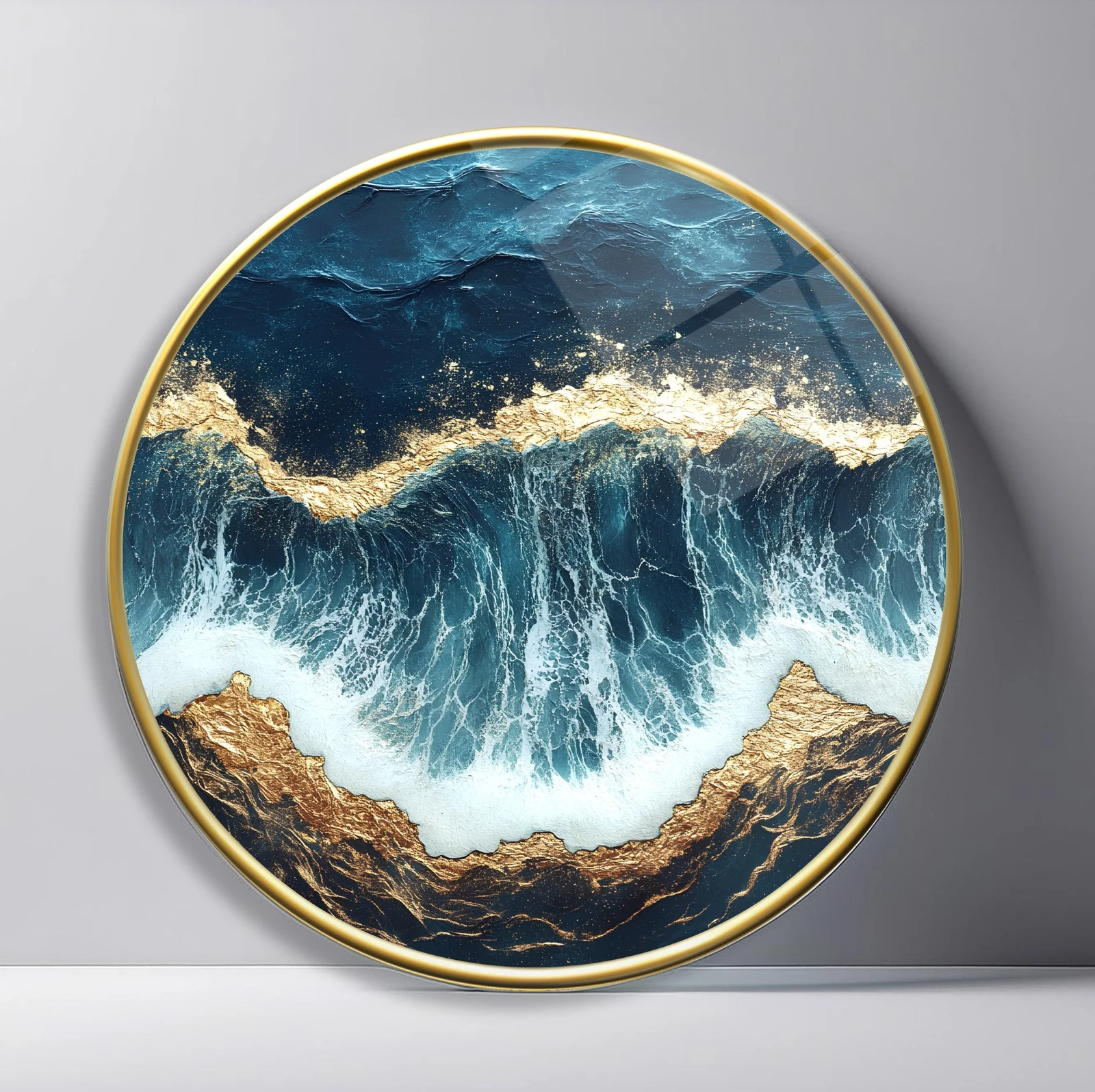 Ocean Wave from Above Round Glass Wall Art featuring white surf crashing between deep blue water and rugged golden rocks