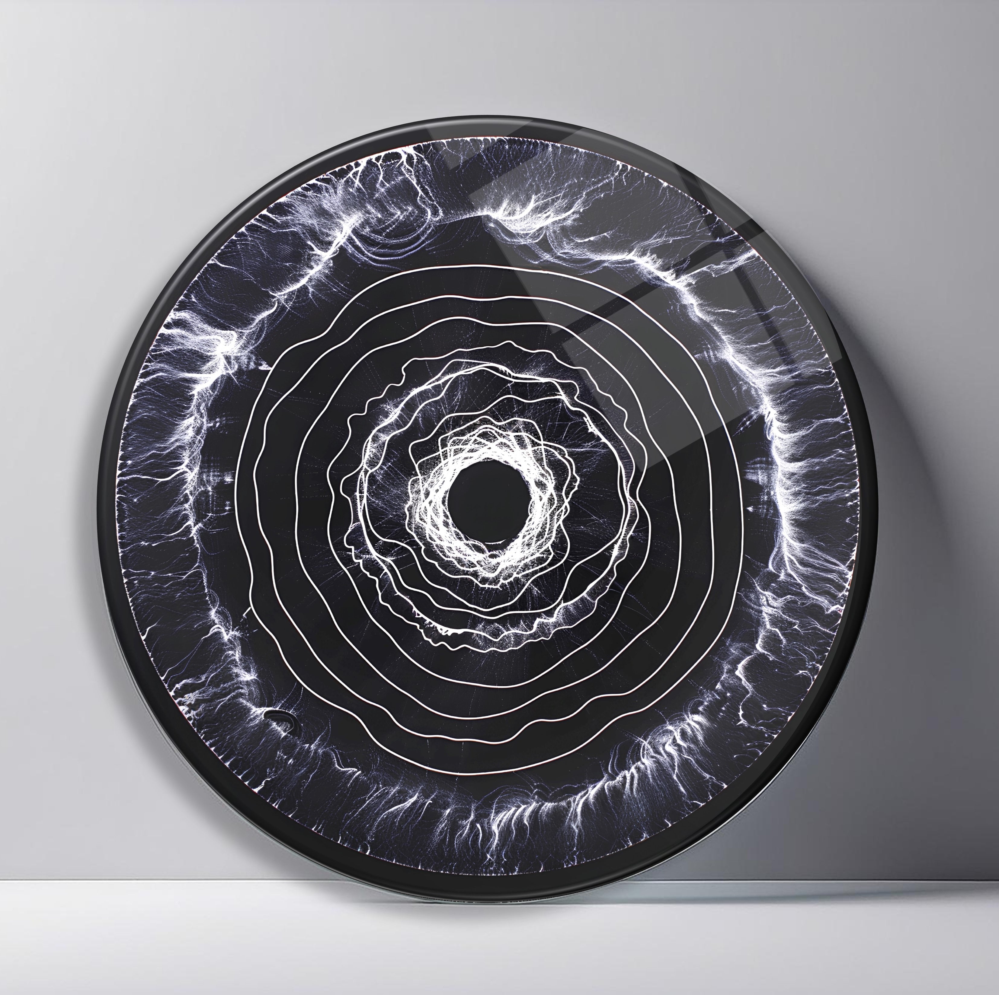 White Energy Rings on Black Round Glass Wall Art featuring irregular white electric rings rippling around a bright central void