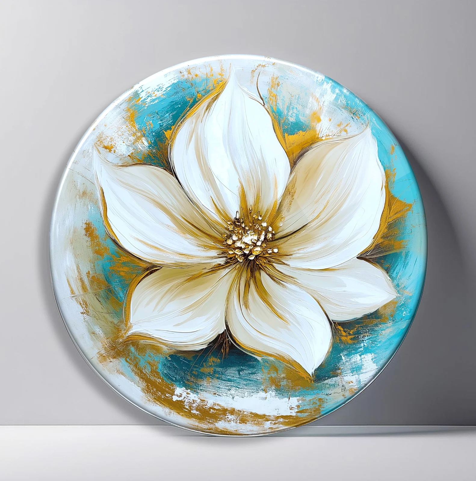 White Magnolia on Turquoise Round Glass Wall Art featuring large white magnolia bloom painted over turquoise and gold texture