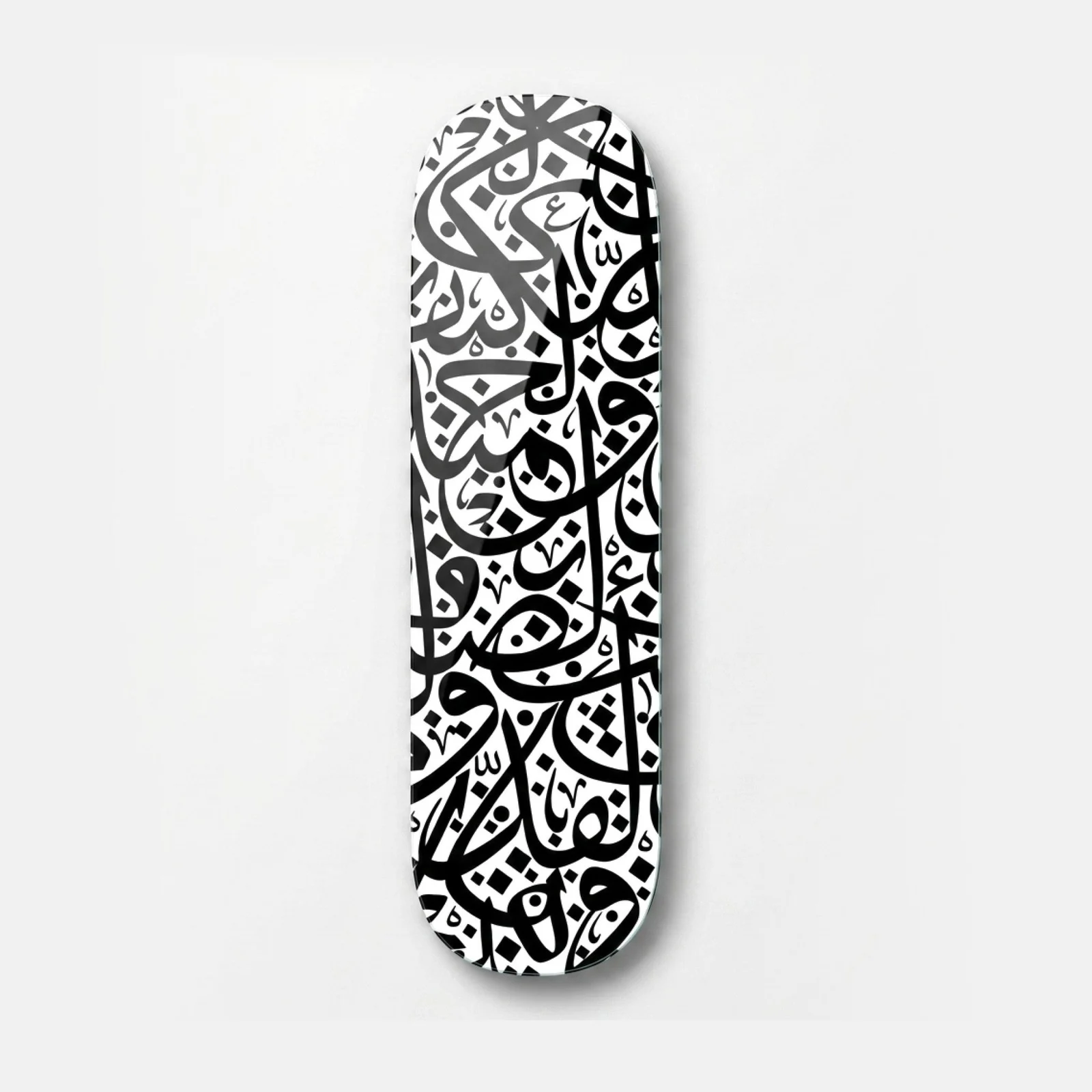 Black and White Arabic Calligraphy Skateboard Glass Wall Art, front product view on a neutral background