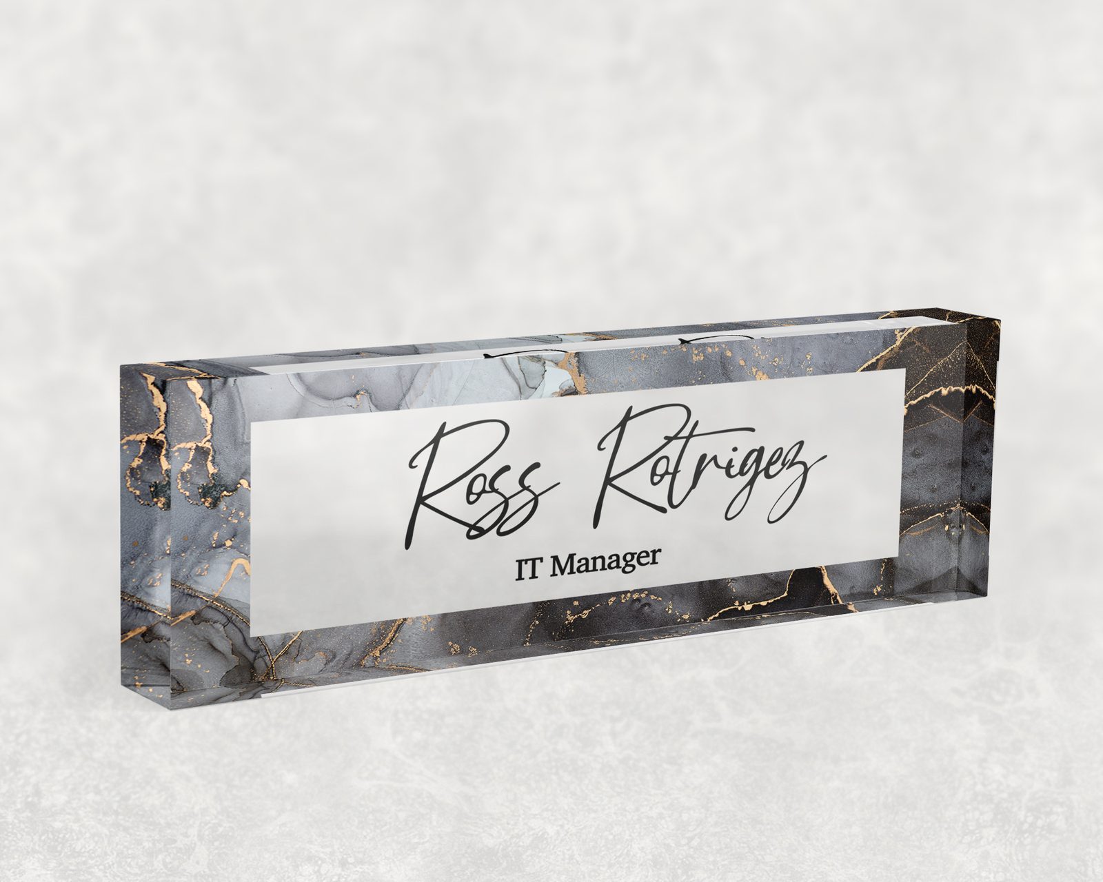 Charcoal and gold marble desk name plate in clear acrylic, personalized with a name and job title